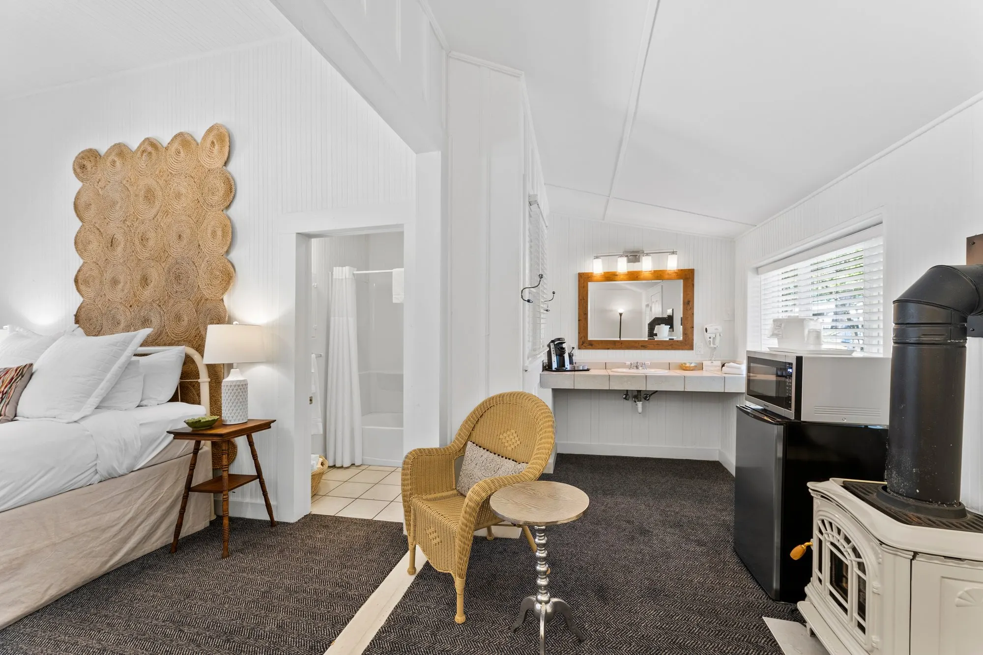 Motel-side room with a woven headboard and enamel stove, The Meyer Hotel
